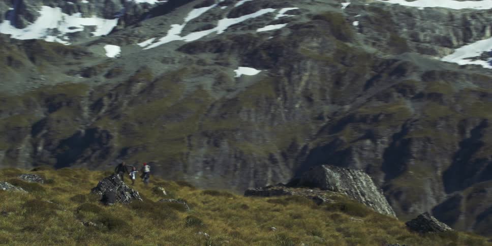 A family hikes beside the mountains