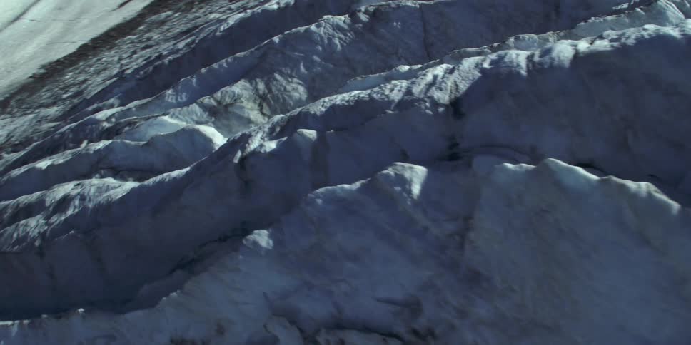 Snow covers the side of a mountain