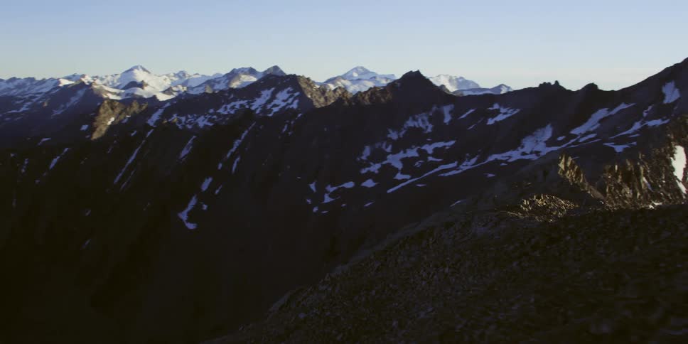 The mountains are tall with ice at the top