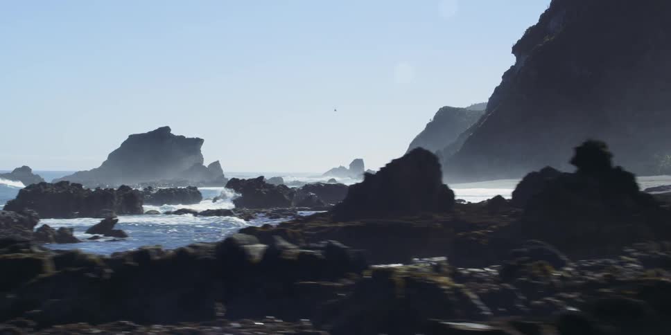 Waves splashing against rocks at the shore