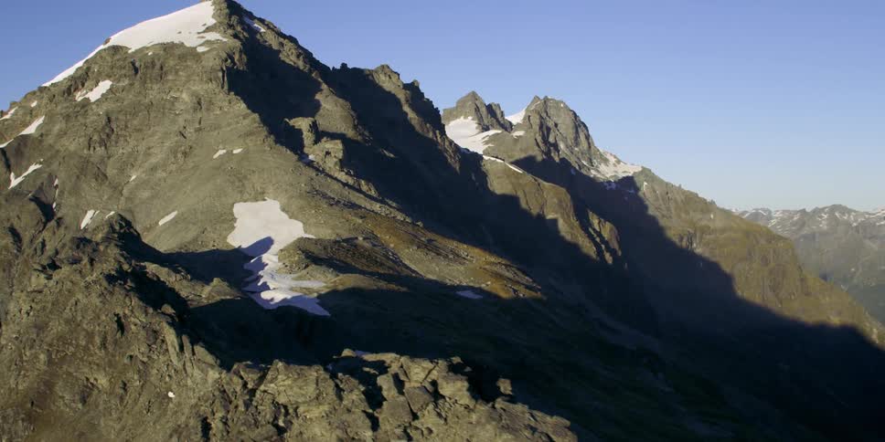 The mountain is high and covered with fog