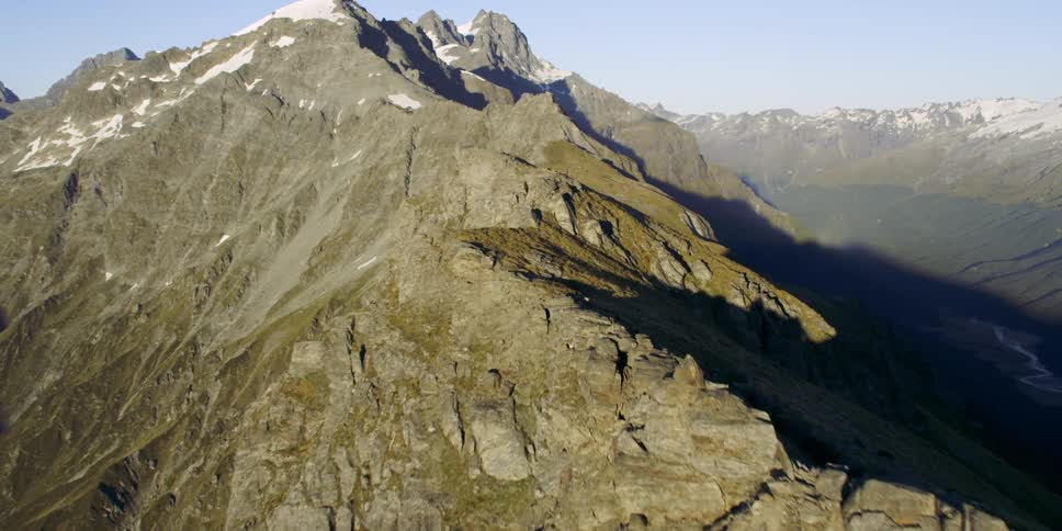 Aerial view snow covered peaks on mountain range