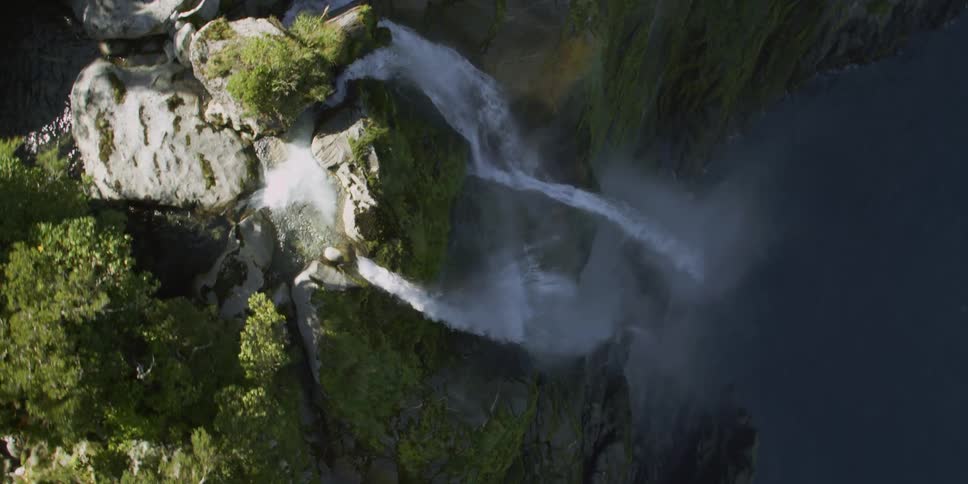 A waterfall crashes over the edge of a cliff