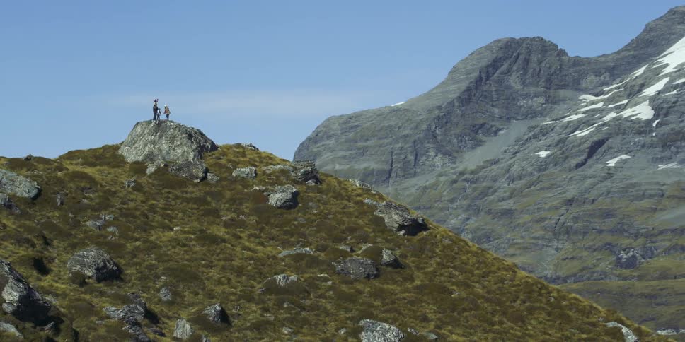 People are standing at the top of the mountain