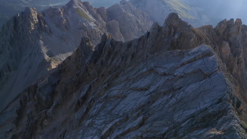 An aerial view of a peak of a mountain range