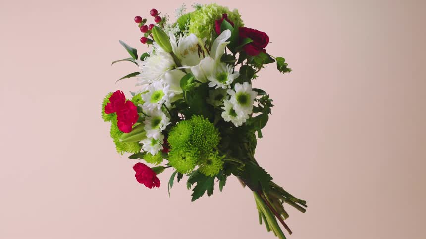A bouquet of flowers turning in the air