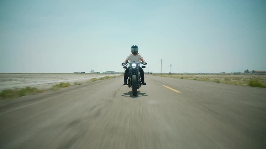 A person is riding their motorcycle on the road