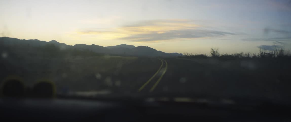 A landscape is revealed near a mountain on an early morning