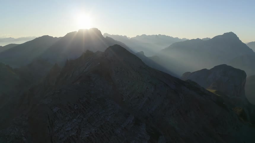 Bright sun shines on the mountain range