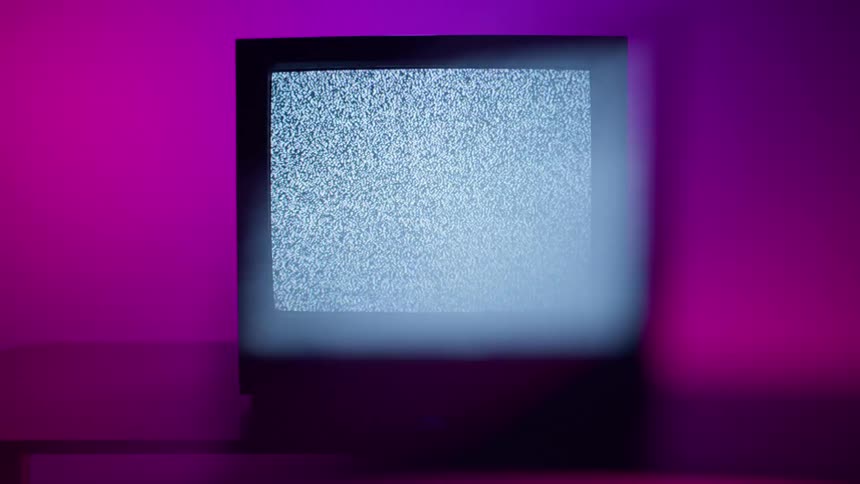 A broken television with a fuzzy screen