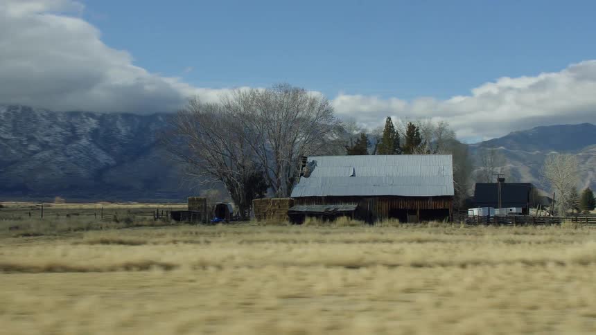 Panning shot of a building in a rural area