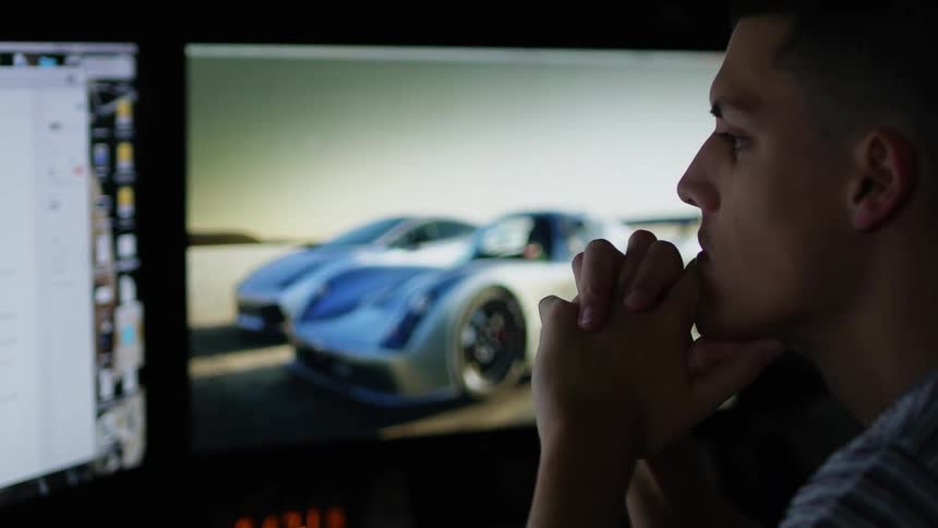 An employee looking at things on a computer screen