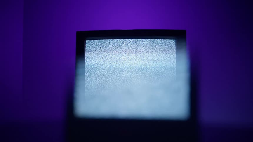 A screen in a stand has nothing but static