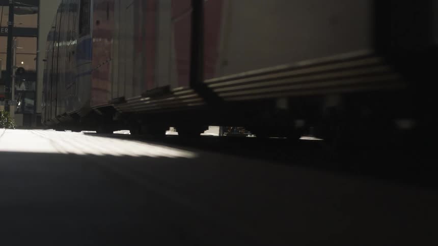 The train passes by the tracks on the road