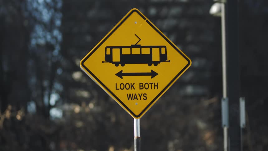 Street sign reminding motorists to look both ways