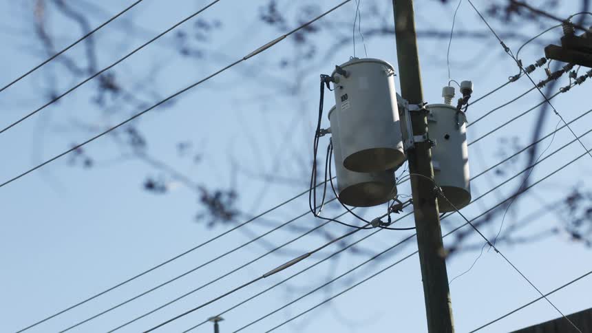 A view of wires on a power pole
