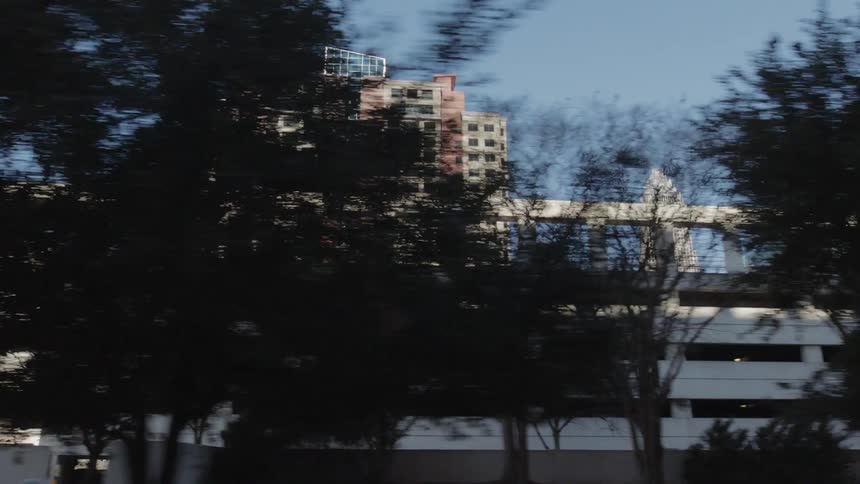 The large parking garage is by the building