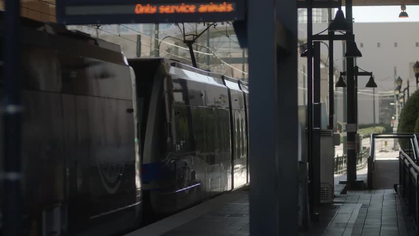 A streetcar in a city leaves the station to go on its route
