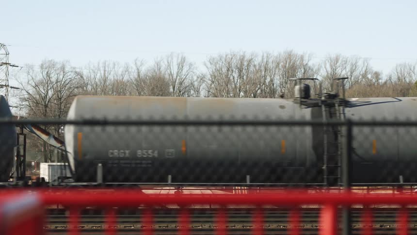 A view of a train driving by outdoors