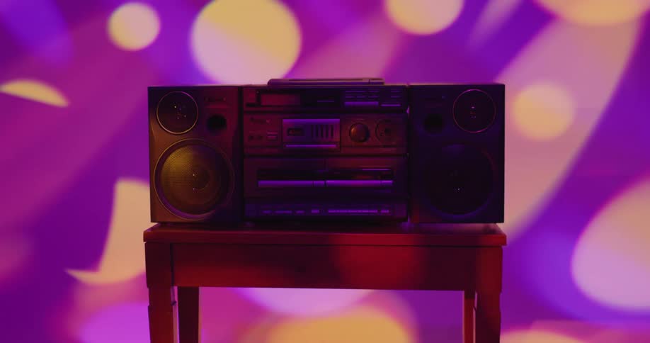 A view of a boombox with colorful lights around it