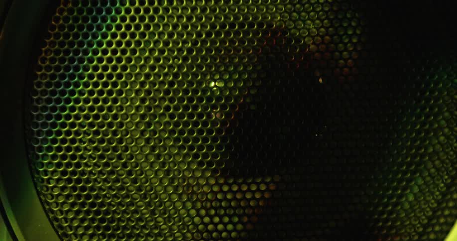 The light is shining on the black speaker