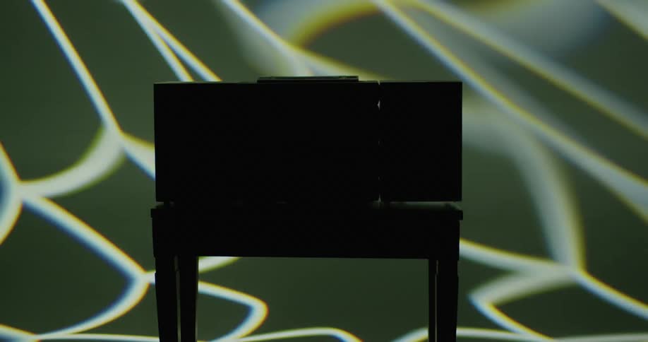 A radio is sitting on the table in the dark room
