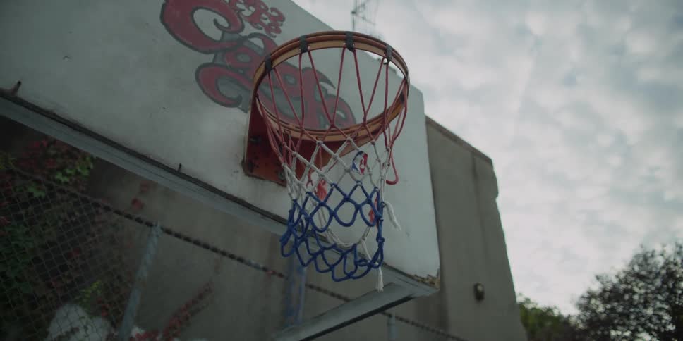 A basketball hoop on a cloudy day