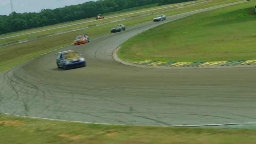 Cars racing on track