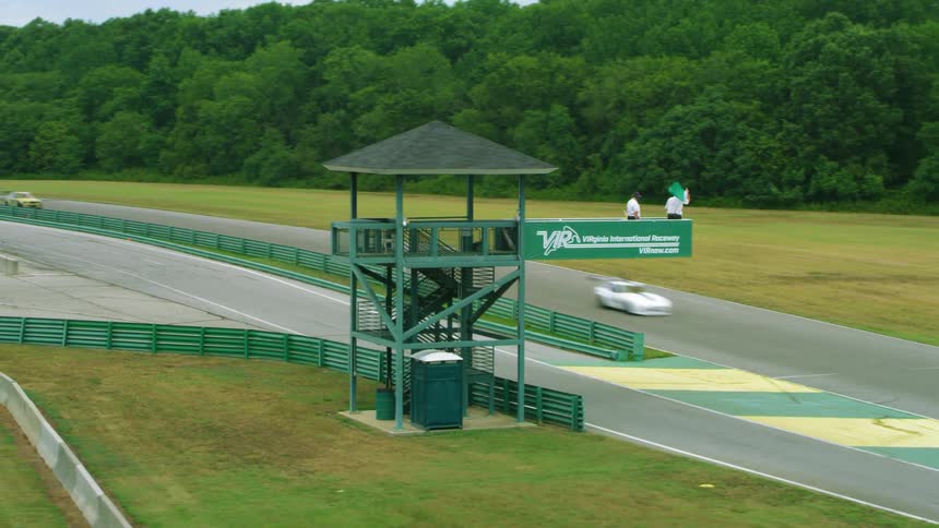 Cars racing on track