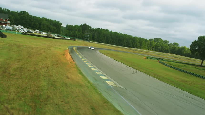Two race cars racing on a track