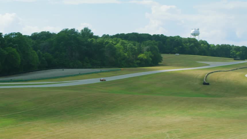 A view of a car driving down a race track