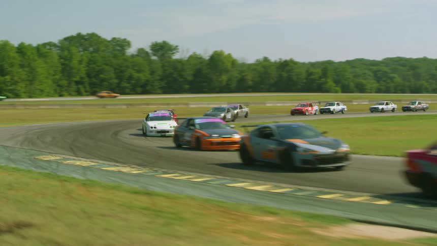 The race cars are racing on the runway