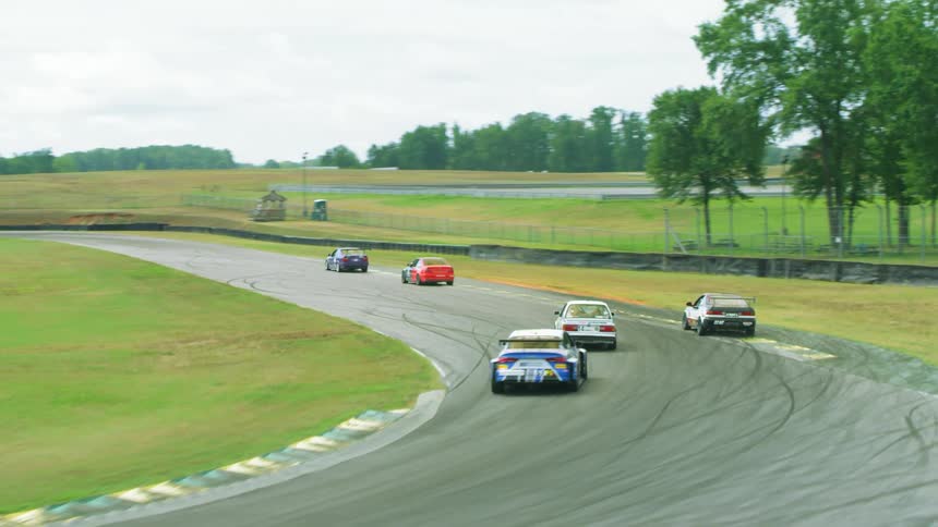 Multiple cars racing on a race track