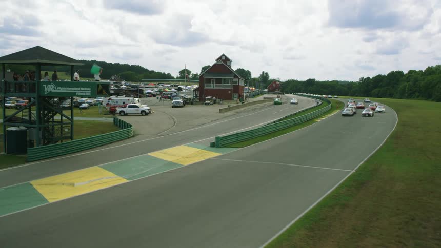 The race cars take off at the starting line
