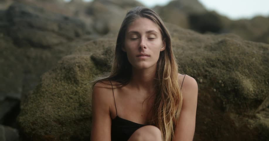 A portrait of a woman sitting outside