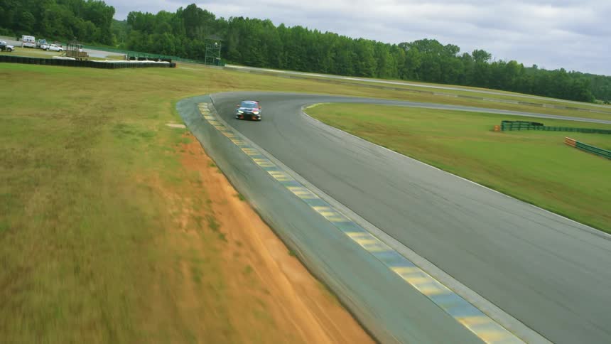 A view of a car racing on a track