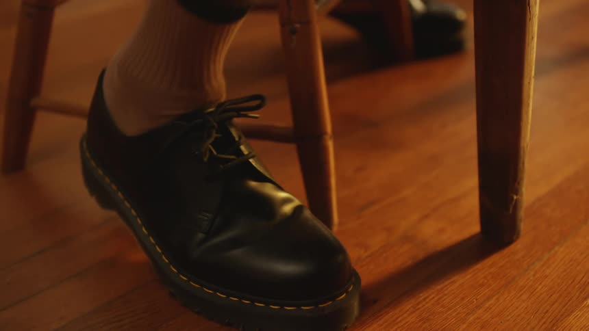 A person is tapping their foot on the ground