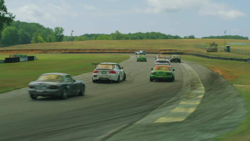 Aerial view of automobiles racing for competition