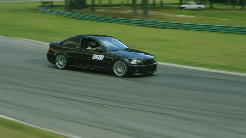 A group of people racing cars around a track