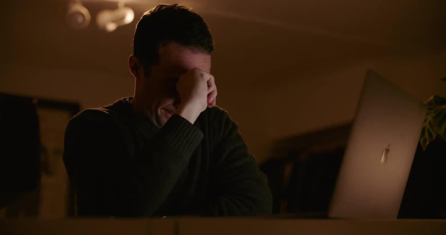 A man that is working on a laptop