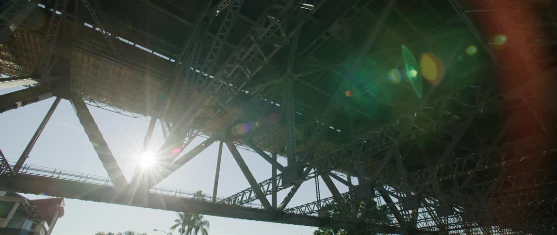 A view of the sun shining through a building