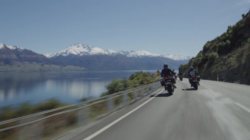 A group of people riding motorcycles outdoors