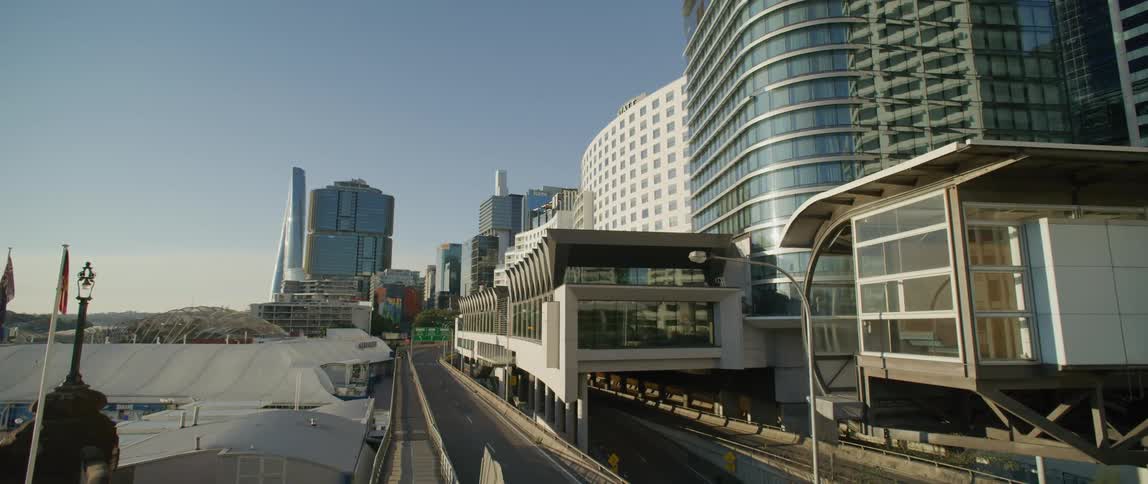 City buildings extend out over highway and exit ramps