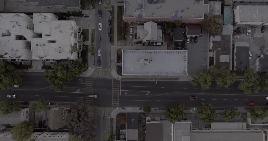 Cars driving down a city street
