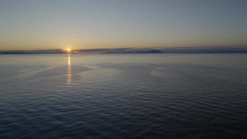 Aerial shot of a ocean at dusk