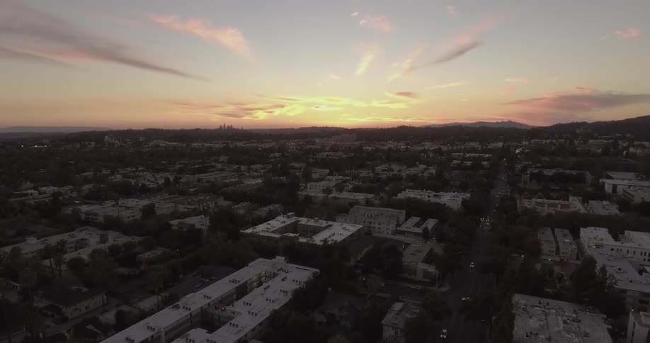 The sun rises over a city
