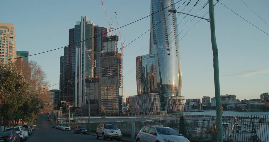 A panning shot of a city with buildings under construction