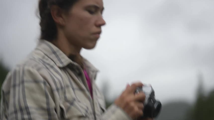 A woman taking photos with a camera