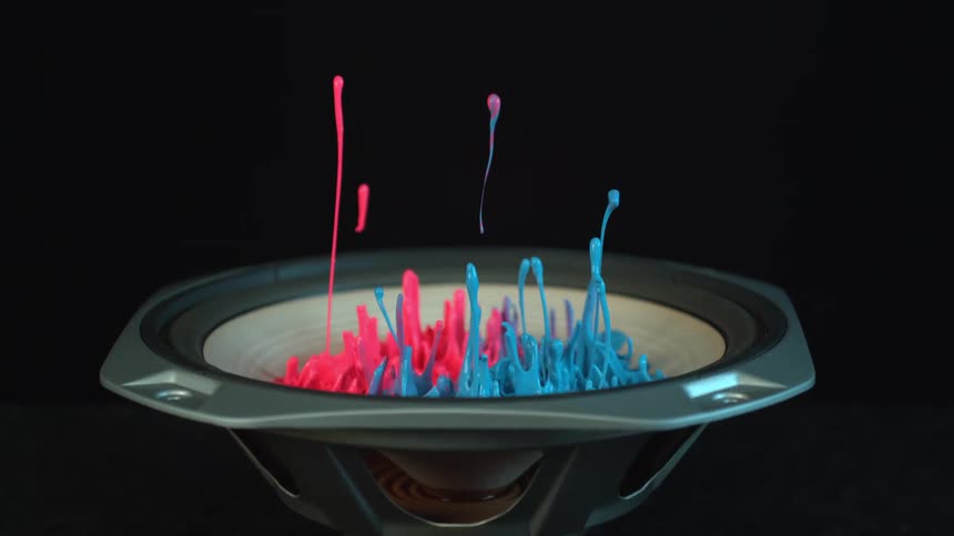 Pink and blue paints move by the vibration of speaker