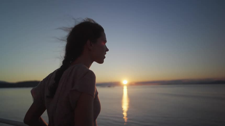 A woman looking out into the lake